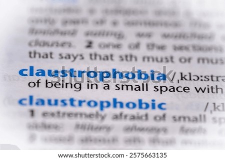 Claustrophobia word in a dictionary. Selective focus, close up.