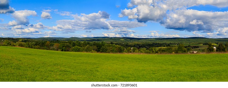 Claverack NY Area In The Hudson Valley Looking At Trees, Rolling Hills, Green Meadows And Farmland In Later Afternoon In Summer.