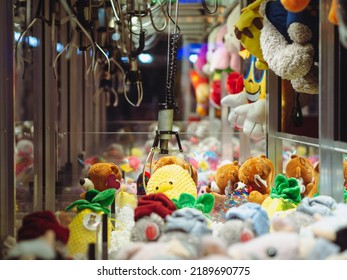 Claw Machines Toy Arcade game with stuffed animal toys on carnival. Entertainment for children in the amusement park - Shutterstock ID 2189690775