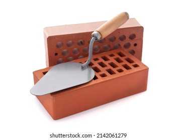 Clay Brick And Trowel Tool Isolated On White Background. Construction Brick With Mason At White