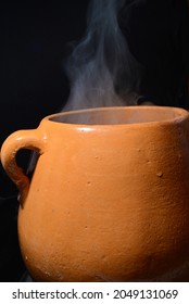 Clay Cooking Pot With Steam Rising