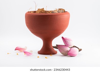 CLAY DHUNUCHI WITH LOTUS ISOLATED ON WHITE BACKGROUND.