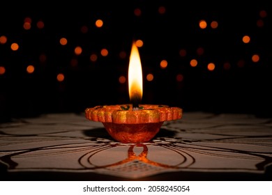 Clay Diya (Lantern) lamps lit during Diwali celebration. Greetings Card Design Indian Hindu Light Festival called Diwali. - Shutterstock ID 2058245054