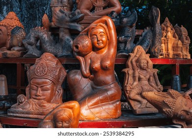 Clay figurines and statuettes in a Buddhist souvenir shop at a pagoda in Vietnam in Asia - Powered by Shutterstock