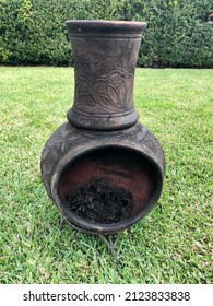 Clay Fire Pit Displayed In Backyard