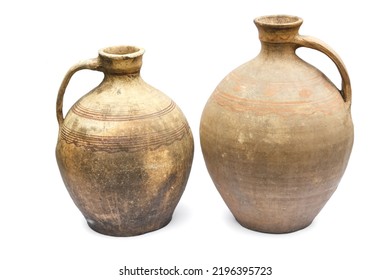 Clay jugs on a white background. Ancient ceramics. Museum exhibits of pottery for water.