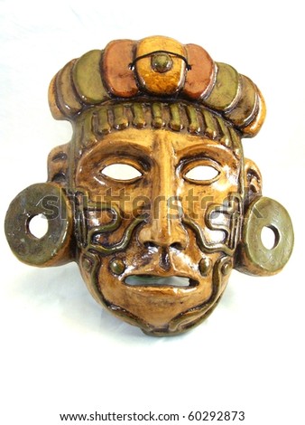 Clay mask of a Maya warrior with tattoos and ear spools.