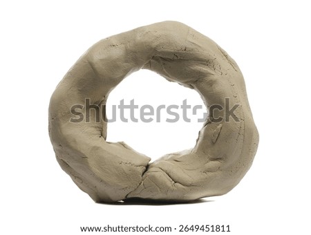 Clay modelling in shape ring, isolated on white