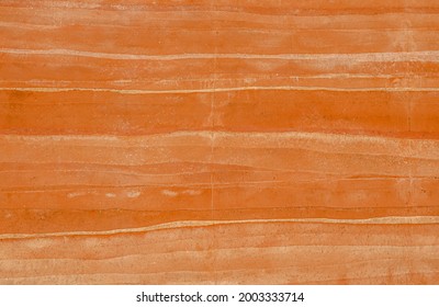 Clay Orange Ochre, Rammed Earth Grunge Texture Background. Compacted Sand Gravel Clay Building With Wall Layers Of Soil Color Natural Earth Tones Of Warm Autumn. Raw Materials Environmentally Friendly