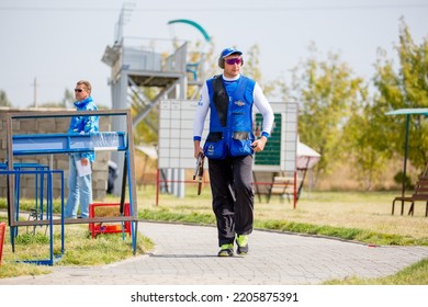 Clay Pigeon Shooting. An Athlete Shoots A Gun At Moving Targets, Sport Gun Shooting, Clay Pigeon Shooting. Training Process At The Shooting Range. Cyprus, Larnaca - August 20, 2022