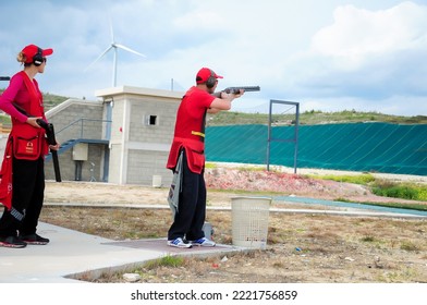 Clay Pigeon Shooting. An Athlete Shoots A Gun At Moving Targets, Sport Gun Shooting, Clay Pigeon Shooting. Training Process At The Shooting Range. Cyprus, Larnaca - August 20, 2022