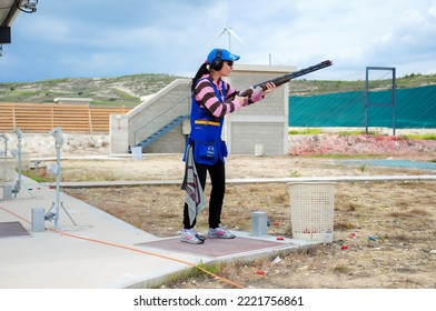 Clay Pigeon Shooting. An Athlete Shoots A Gun At Moving Targets, Sport Gun Shooting, Clay Pigeon Shooting. Training Process At The Shooting Range. Cyprus, Larnaca - August 20, 2022