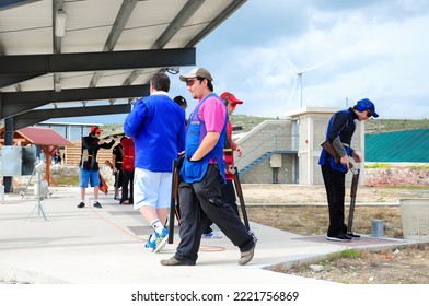 Clay Pigeon Shooting. An Athlete Shoots A Gun At Moving Targets, Sport Gun Shooting, Clay Pigeon Shooting. Training Process At The Shooting Range. Cyprus, Larnaca - August 20, 2022