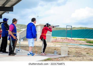 Clay Pigeon Shooting. An Athlete Shoots A Gun At Moving Targets, Sport Gun Shooting, Clay Pigeon Shooting. Training Process At The Shooting Range. Cyprus, Larnaca - August 20, 2022