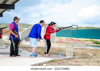 Clay Pigeon Shooting. An Athlete Shoots A Gun At Moving Targets, Sport Gun Shooting, Clay Pigeon Shooting. Training Process At The Shooting Range. Cyprus, Larnaca - August 20, 2022