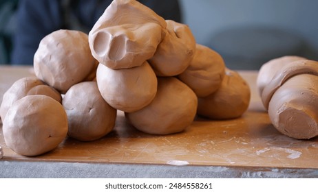 Clay pile on a table for making ceramic pottery in the throwing wheel. - Powered by Shutterstock