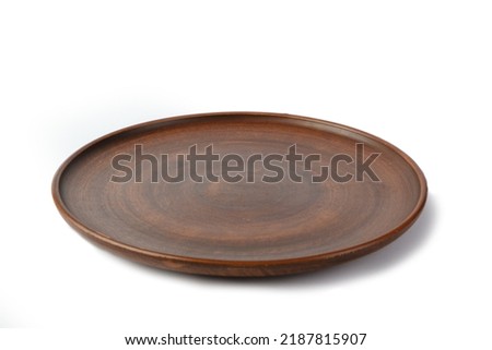 Clay plate isolated on white background. Side view.