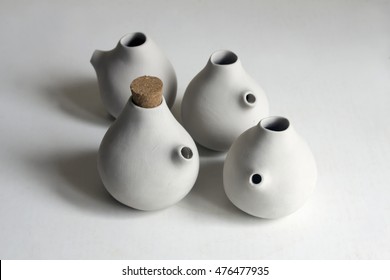 Clay pottery ceramics drying before being fire. Raw clay pots on white background. 