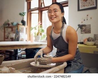 Clay, pottery or creative woman in workshop working on an artistic cup or mug in small business. Smile, artistic girl or happy Japanese designer manufacturing handicraft products as entrepreneur - Powered by Shutterstock