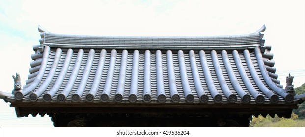 The clay roof of a Japanese temple gate