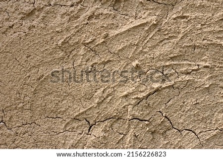 Clay wall and crack texture from dryness with plenty empty copy space for quote and background usage