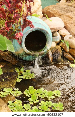 Clay water feature near a pond
