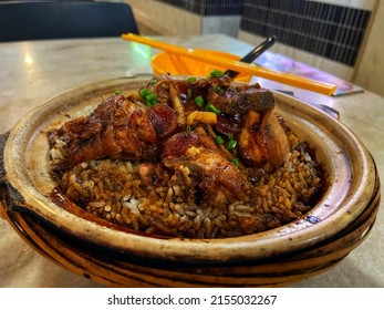 Claypot Chicken Rice Mixed With Pork And Salted Fish - A Famous Chinese Dish In Kuching, Sarawak