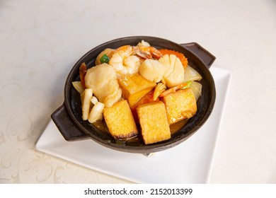 Claypot Seafood Tofu And Vegetable Of Traditional Cantonese Yum-cha Asian Gourmet Cuisine Meal Food Dish On The White Serving Plate And White Table