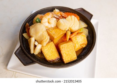 Claypot Seafood Tofu And Vegetable Of Traditional Cantonese Yum-cha Asian Gourmet Cuisine Meal Food Dish On The White Serving Plate And White Table