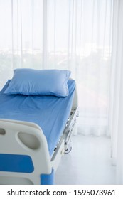 Clean Adjustable Patient's Bed In Hospital Room. Clean Adjustable Bed Is For Patient Who Admitted To Hospital For Medical Treatment And Rehabilitation. Health Care Insurance Coverage & P.A. Concept.  