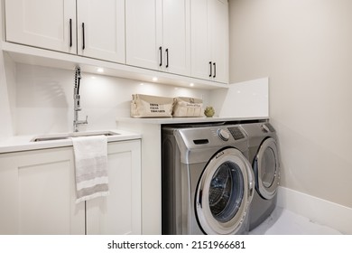 Clean Bright Laundry Room With Washer And Dryer
