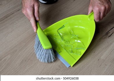 Clean Up Broken Water Glass With Broom And Dustpan