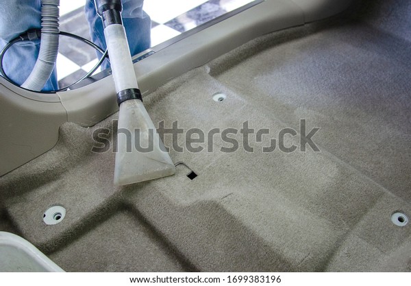 Clean the car carpet with a cleaning\
machine.Kill germs with chemicals and dirt in the\
car.