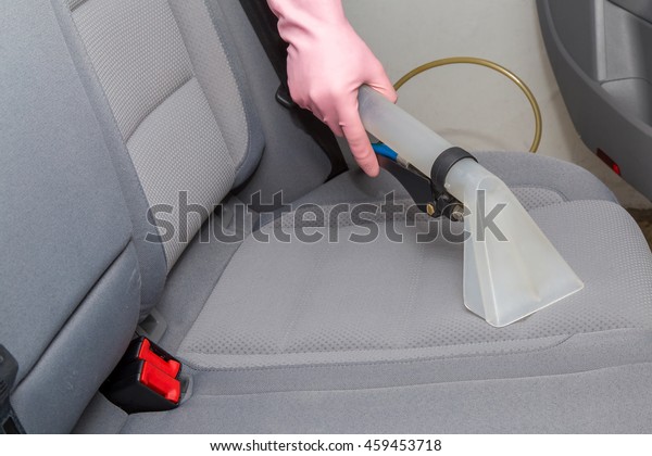 Clean car interior after light gray textile\
seats chemical cleaning with professionally extraction method.\
Early spring cleaning or regular clean\
up.
