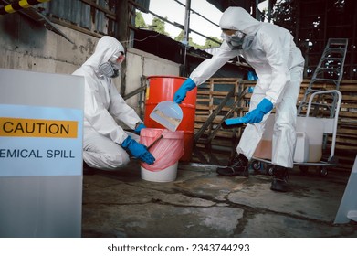 Clean up Chemical Liquid Spill. Scoop Materials into Toxic Waste Red Bag and Thick Plastic Barrels for Disposal, Dispose of Material Safely. Part of Basic Practical Training for Chemical Spill.