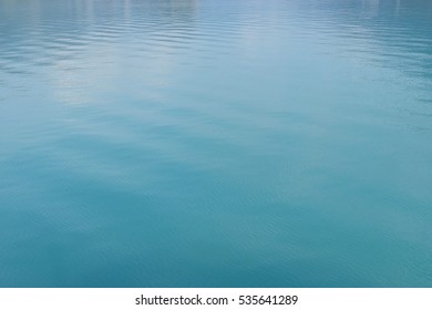 Clean And Clear Turquoise Water In A Lake In Switzerland