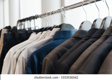 Clean Colourful Business Shirts, Suit Jackets Hanging On Rack In Laundry Room, Fashion Trend Concept. Closeup - Image