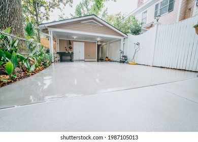Clean Concrete Driveway Pressure Washing - Shutterstock ID 1987105013