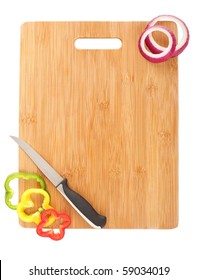 Clean cutting board, a knife and vegetable slices