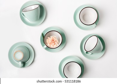 Clean Dishes, Coffee Or Tea Set. Plenty Of Elegant Porcelain Cups And Saucers With Flower Inside At White Background, High Key, Top View And Flat Lay.