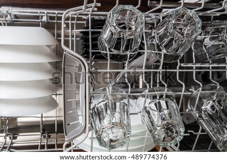 Clean dishes in a modern dishwasher machine