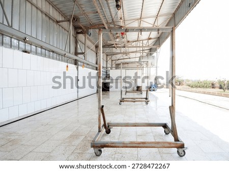 Clean and empty slaughterhouse interior in Turkey, prepared for livestock processing during Eid al-Adha and Kurban Bayramı, showing hygienic conditions, industrial structure and religious tradition.
