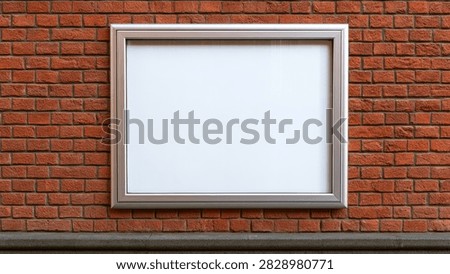 A clean, empty white sign or poster is framed and attached to a rustic red brick wall, ready for custom content.