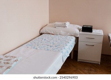 Clean Examination Room with Two Beds and Modern Medical Equipment. - Powered by Shutterstock