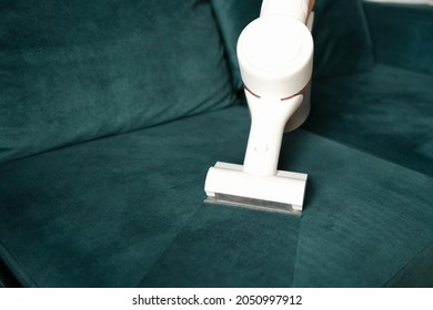 Clean Fabric Upholstery With White Vacuum Cleaner. Household Appliances For Cleaning Furniture