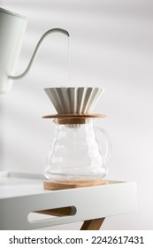 Clean the filter paper before drip coffee