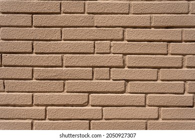 Clean, Freshly Painted, Tan, Generic, Brick Cinder Block Wall Background. Brown Collor Paintec