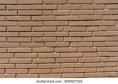 Clean, Freshly Painted, Tan, Generic, Brick Cinder Block Wall Background. Brown Collor Paintec