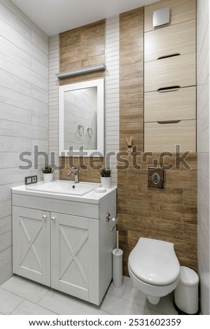 A clean and functional bathroom design featuring modern fixtures, wooden accents, and a glass-enclosed shower creating a warm and inviting atmosphere