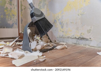 Clean Up Garbage After Repairs.Sweep Up Construction Debris With A Brush In A Dustpan.Sweeping At Home.Tools For Cleaning The House.Make Home Repairs.The Dust And Debris After The Renovation.Handyman